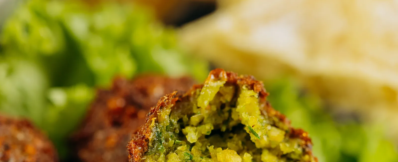 Crispy falafel with fresh greens and pita
