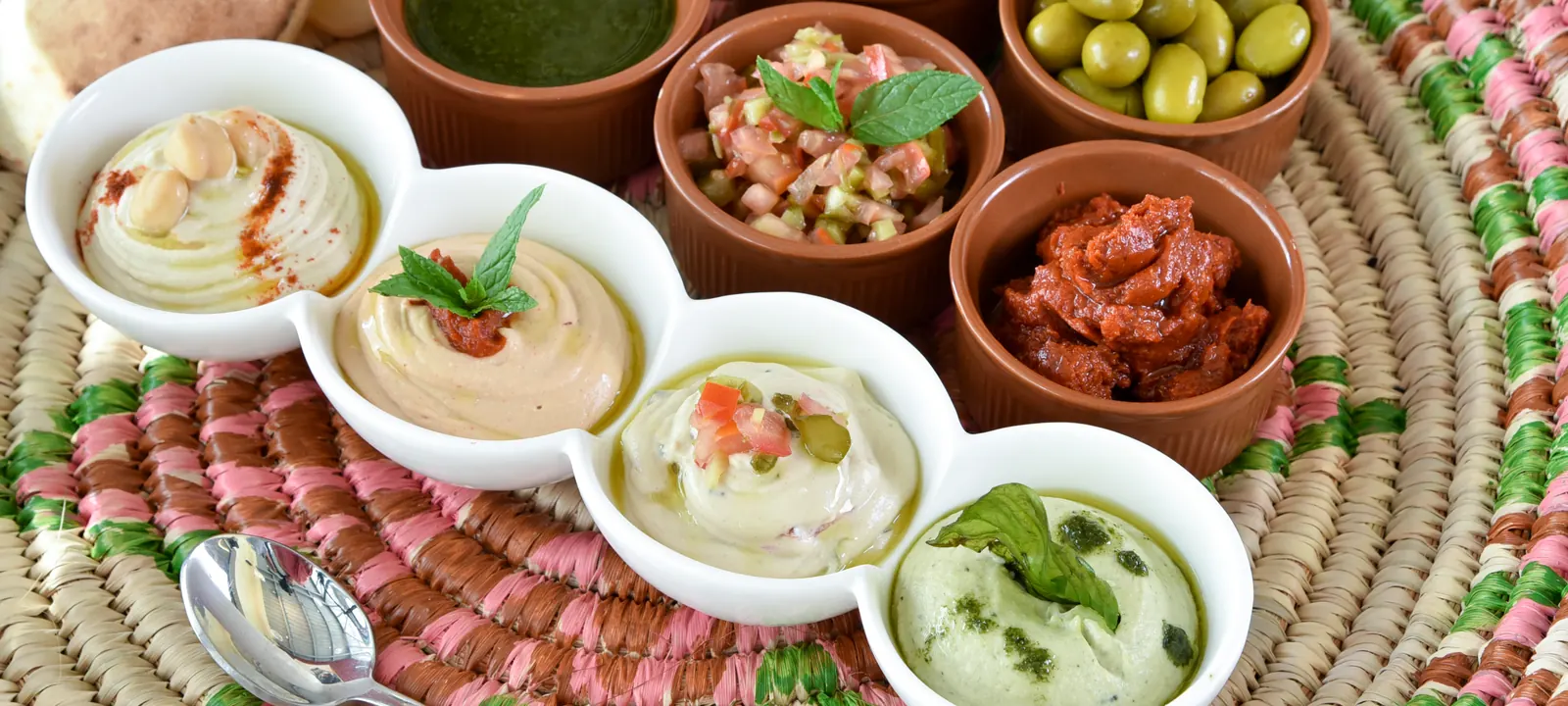 Middle Eastern dips, pita, chickpeas, olives, and appetizer spreads