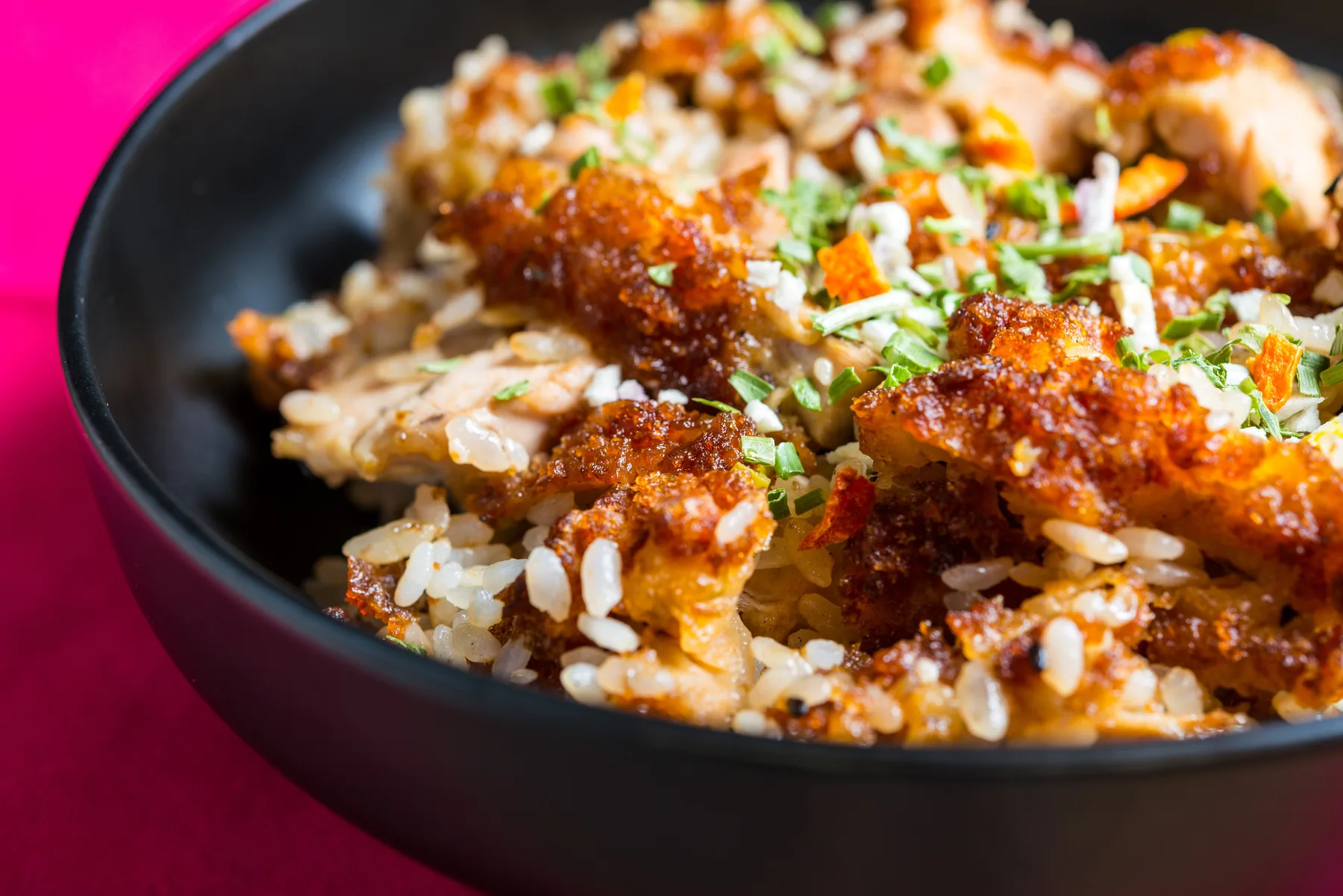 Mediterranean rice bowl with seasoned meat and herbs